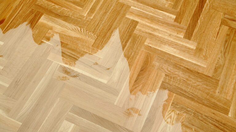 Wooden parquet floor with partially applied varnish