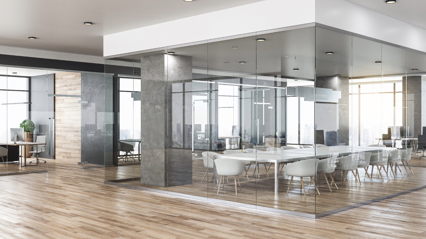 Modern office interior with glass walls and wood flooring